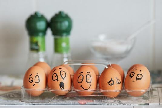 Five eggs representing different emotions.